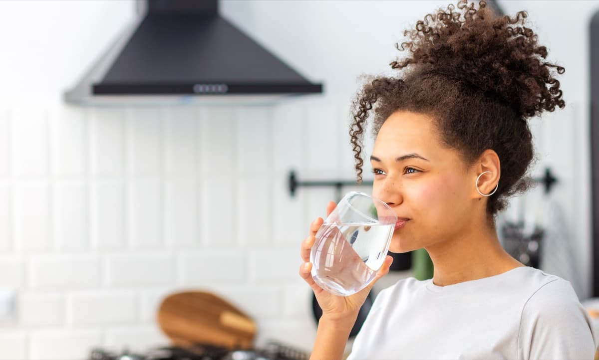 Woman drinking clean soft water