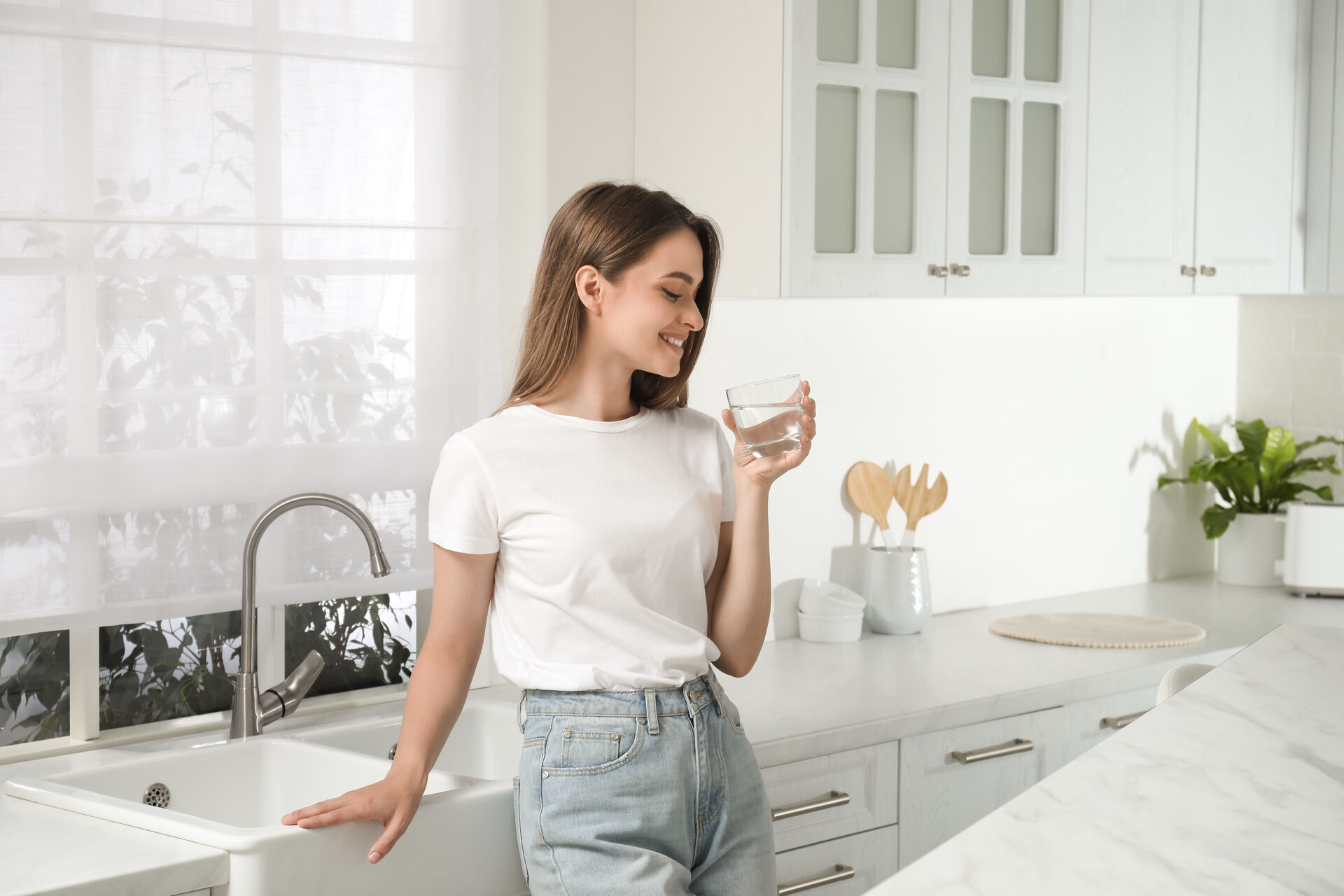 Woman enjoying clean filtered water